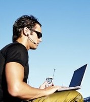 man with laptop and cell phone